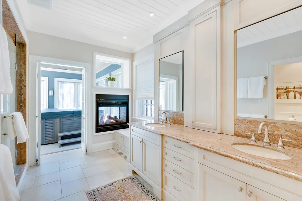 A bright, tidy bathroom with a tiled floor and a large vanity